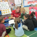 Emily Baseler reads to pre-school children.