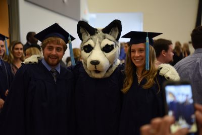 Class of 2017 Graduates with Jonathan the Husky Mascot