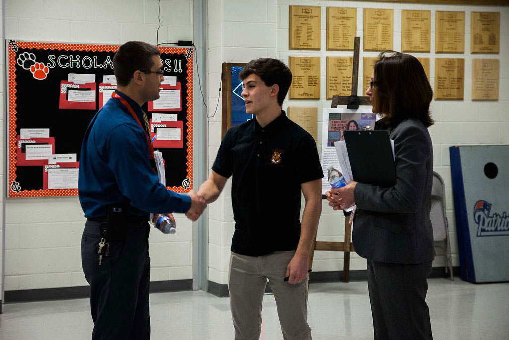 7:10 a.m.— Baker introduces Matt Angelo to Alex Rooney, a senior and future Neag School student, before the school day starts. (Photo credit: Cat Boyce/Neag School)