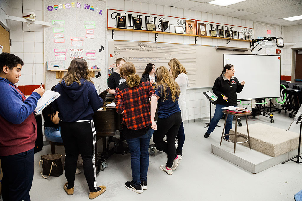 9:00 a.m. — Students in the Modern Music Ensemble class practice for a community performance, lead by Neag School alumna, Kate Anderson, pictured on the right. (Photo credit: Cat Boyce/Neag School)