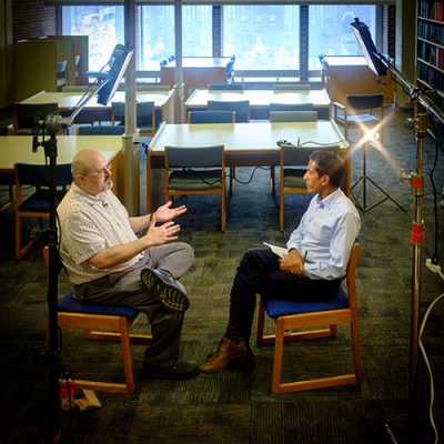 James Kaufman, professor of educational psychology, is interviewed by CNN’s Sanjay Gupta at the Home Babbidge Library on July 28, 2015. (Peter Morenus/UConn Photo)
