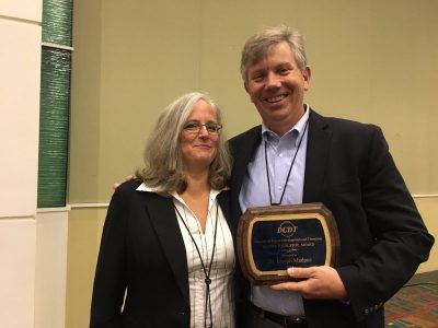 Joseph Madaus receives the Oliver P. Kolstoe Award from the Council for Exceptional Children’s Division on Career Development and Transition. Also pictured is Valeria Mazzotti from the University of North Carolina-Charlotte, and president of DCDT. 