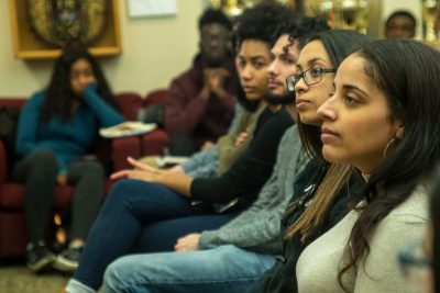 Students listen in on Joseph Cooper’s remarks at an event held last month to celebrate the release of his book, <i>From Exploitation Back to Empowerment</i>. (Eve Lenson/Neag School)