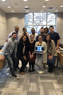 Graduate students in counselor education smile together.