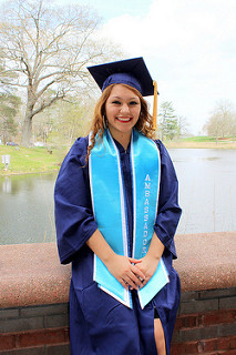 Kelly Chuquihuanca smiles outdoors in her regalia.