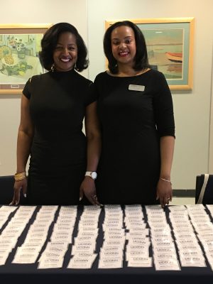 Dominique Battle-Lawson and Mia Hines, academic advisors in the Neag School, greet guests at the Education Career Fair.