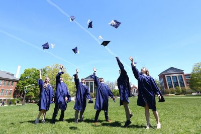 Neag School Class of 2019 grads celebrate outside of the Student Union during UConn Commencement.