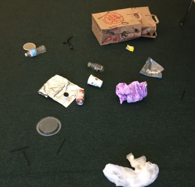 To create the crime scene, I collected nine of the top ten items polluting our oceans and scattered them on the floor.