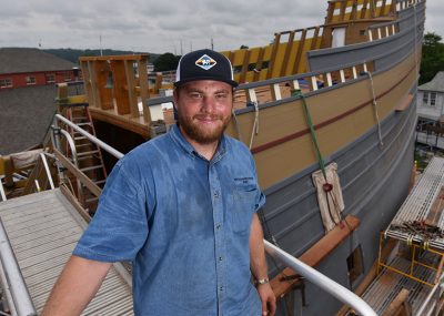Casey Cochran takes a break while working to restore the Mayflower II. 
