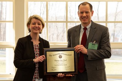 Thomas Van Hoof, pictured on the right, receives the Center for Excellence in Teaching and Learning (CETL) award from Aynsley Diamond, director of faculty outreach and engagement at CETL.