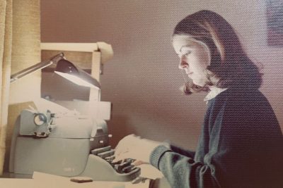 Julie Wood typing on manual typewriter.
