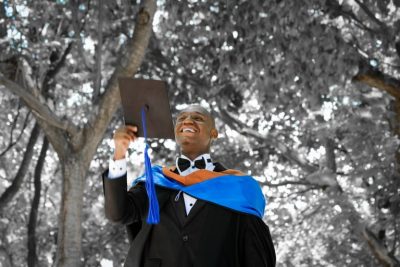 Student in graduation gown. 