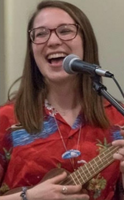 Adrienne Foret plays ukulele and sings.