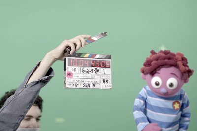 Yanniv Frank on set with puppet CJ.
