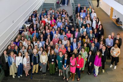 Group of professionals at a conference gather.