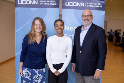 Elizabeth, left, and James Degnan, right, gather with their student scholarship recipient Ashanty Gomez during the Neag School’s annual Scholarship Celebration.