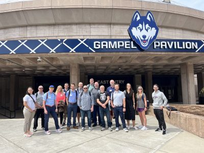 ECE instructors stand in front of UConn's Gampel Building.