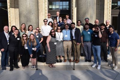 Music Education alumni gather on steps.