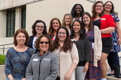 Faculty and staff from the Teacher Education program gather on the steps at UConn Hartford.