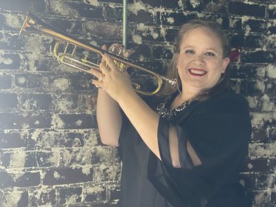 Ellie Campbell holds a trumpet.