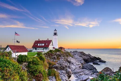 A lighthouse in Portland, Maine. [Links to event registration website].
